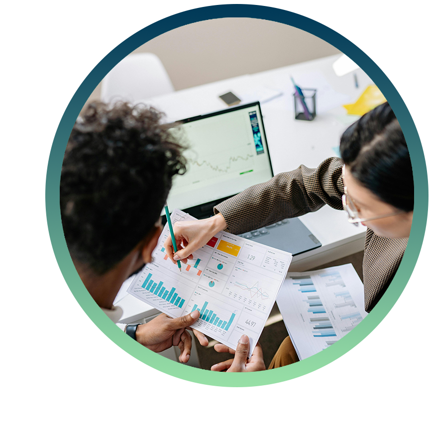 Work colleagues review a series of graphs.